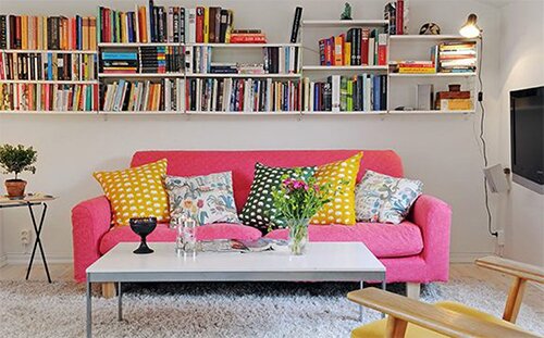 pink sofa in the small flat